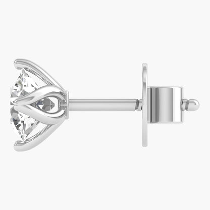 Silver earring with a clear gemstone on a white background