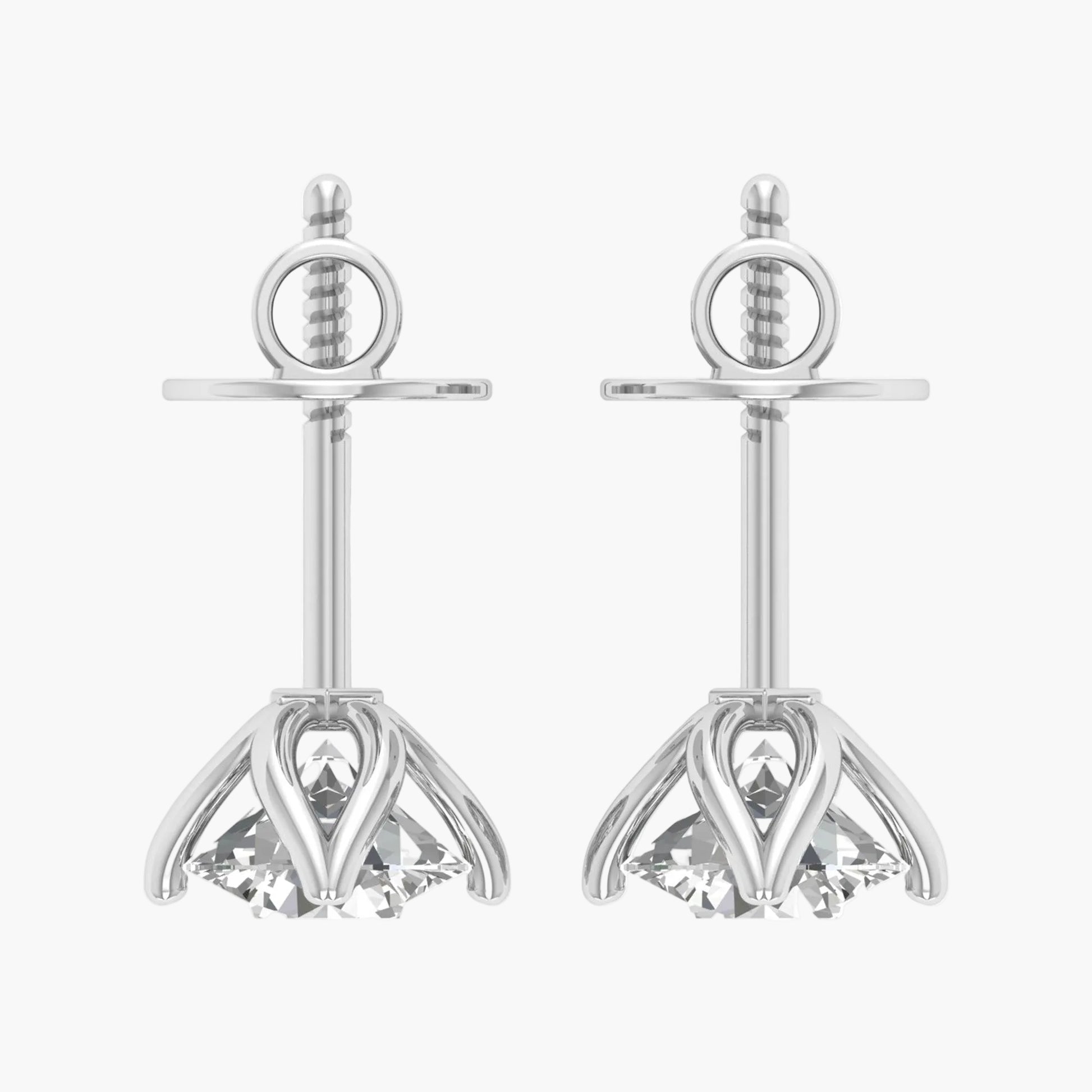 Pair of silver earrings with clear gemstones on a white background