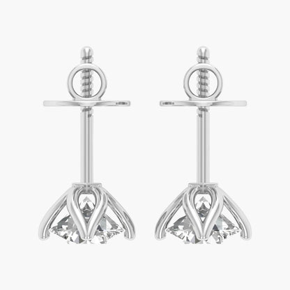 Pair of silver earrings with clear gemstones on a white background