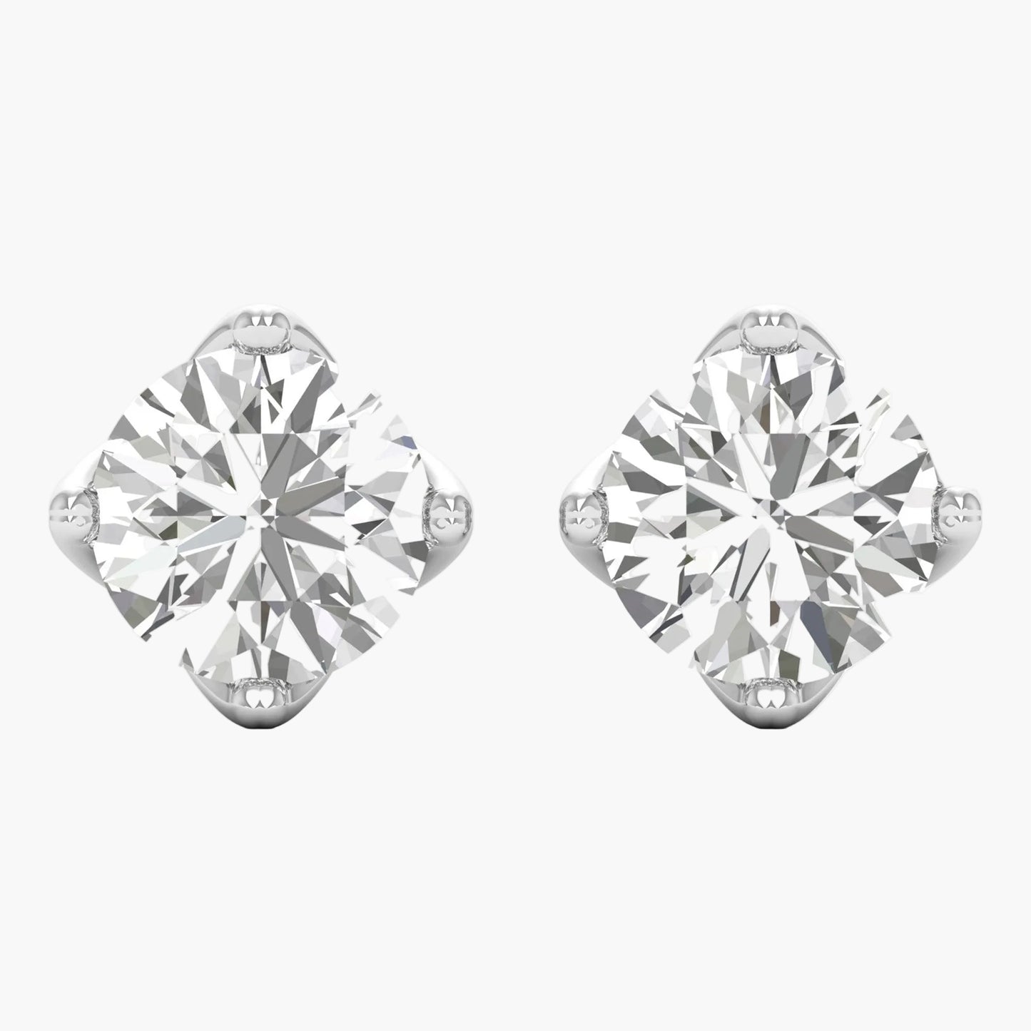 Pair of diamond stud earrings on a white background