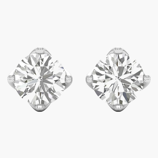 Pair of diamond stud earrings on a white background