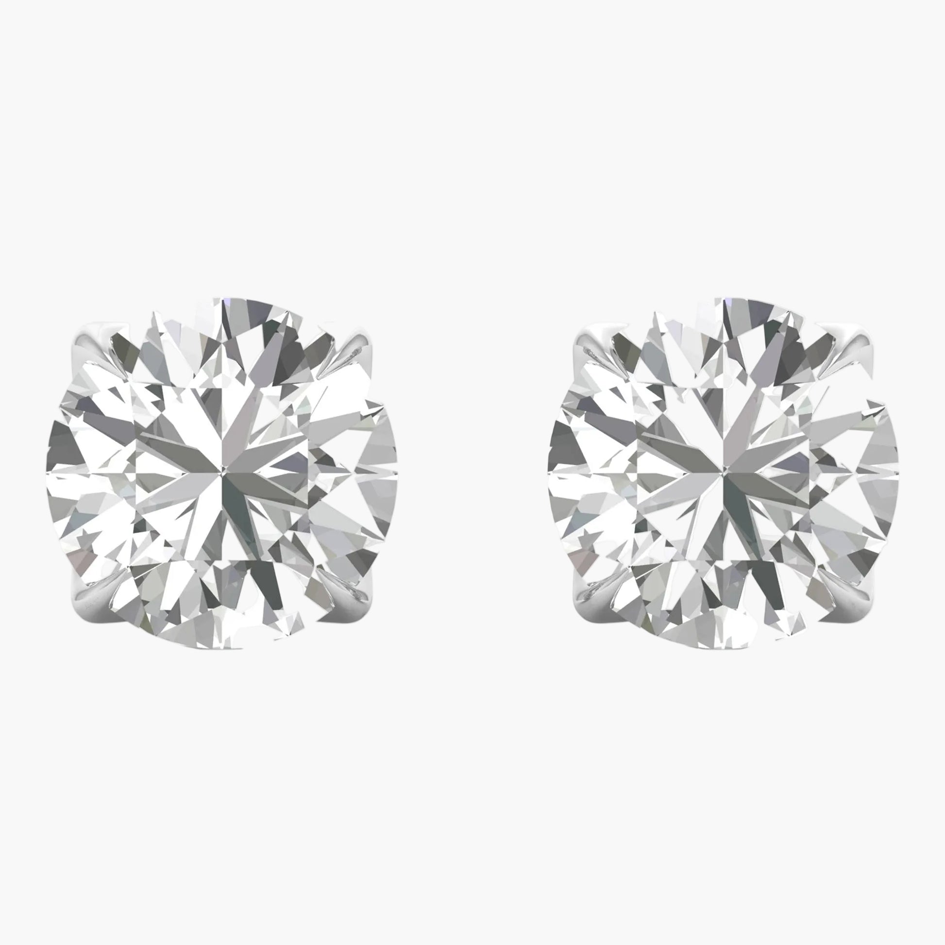 Pair of diamond stud earrings on a white background