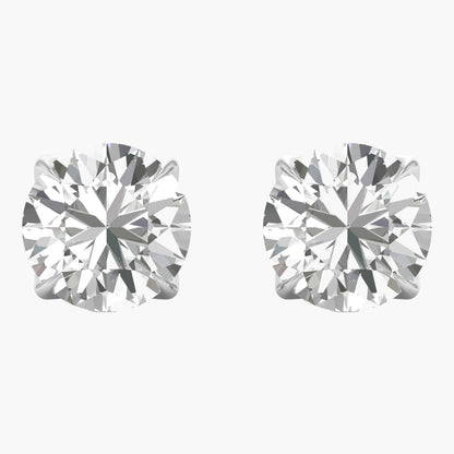 Pair of diamond stud earrings on a white background