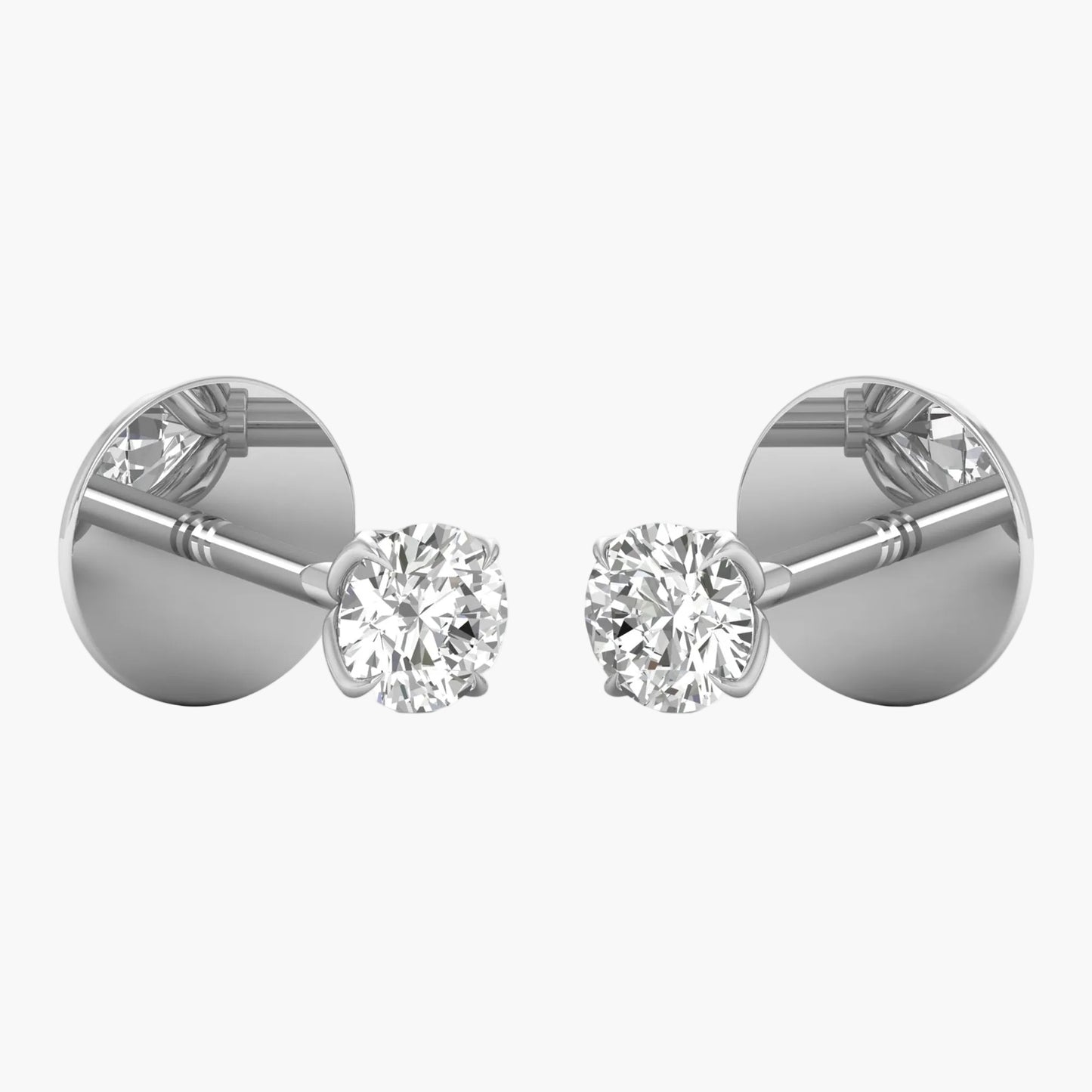 Pair of diamond stud earrings on a white background