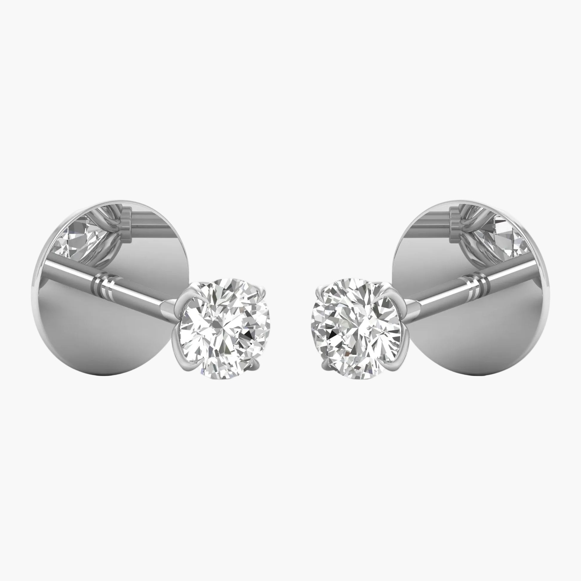Pair of diamond stud earrings on a white background
