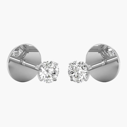 Pair of diamond stud earrings on a white background