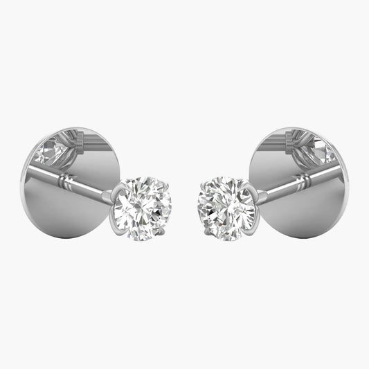 Pair of diamond stud earrings on a white background