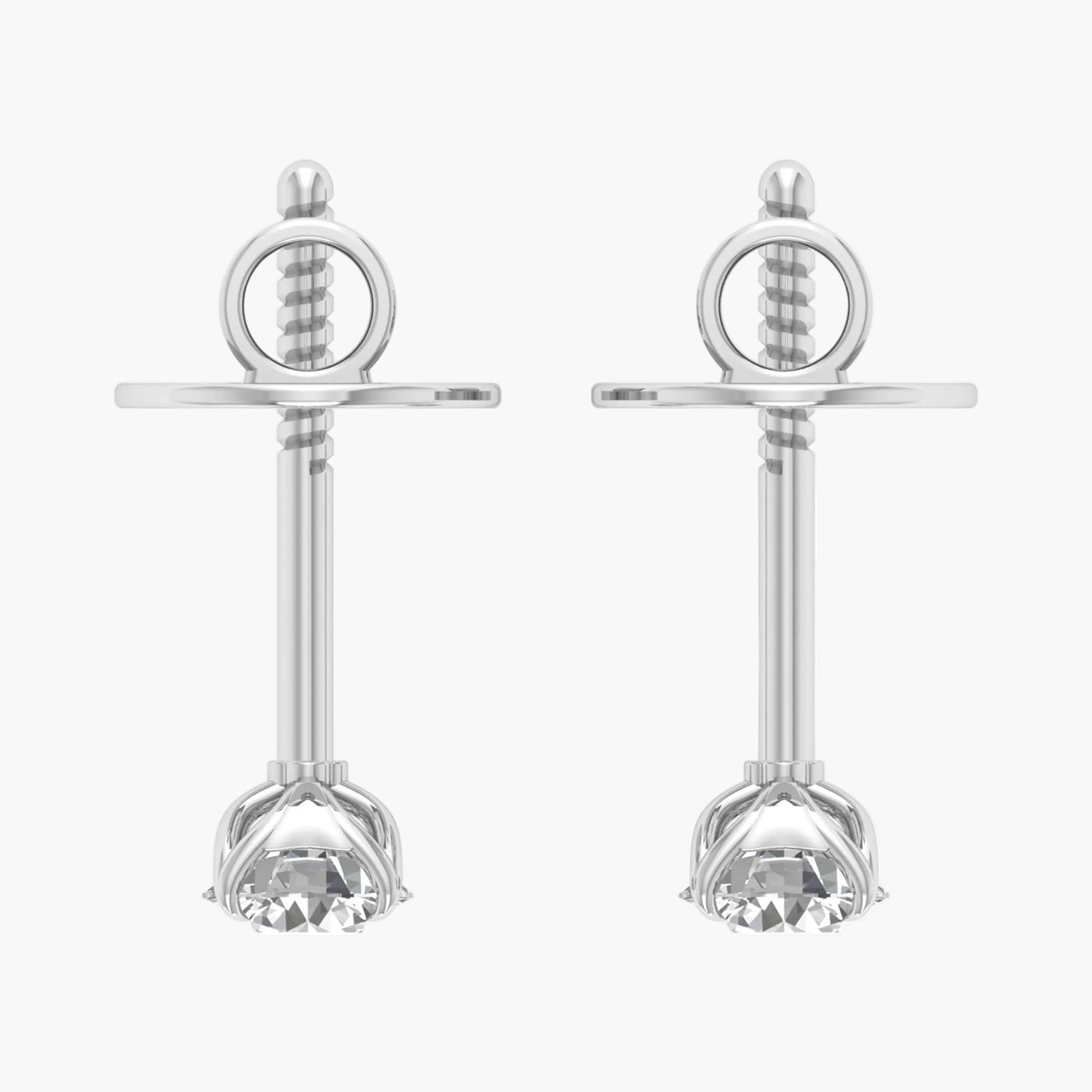 Pair of silver earrings with circular top and flower-like bottom on a white background