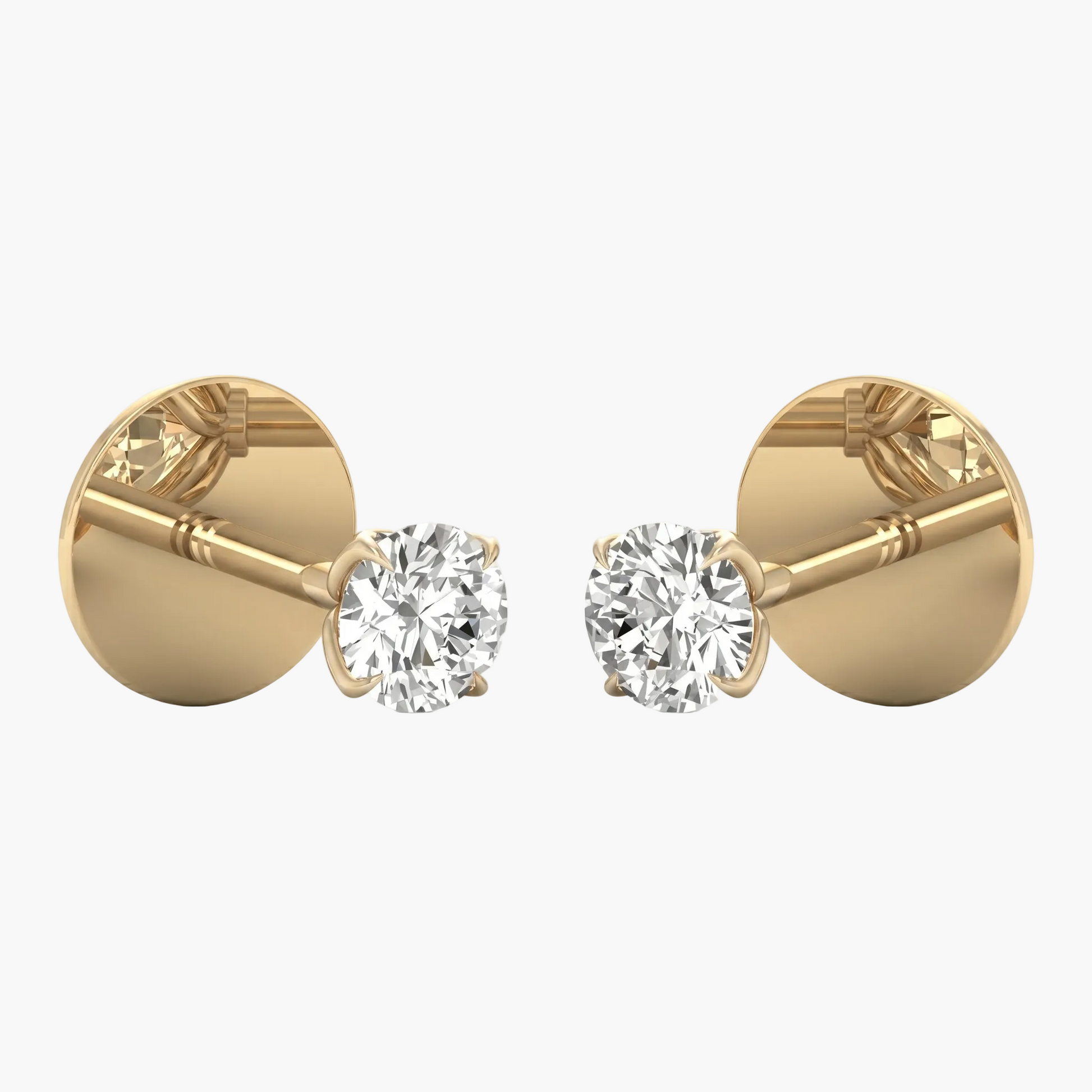 Gold earrings with clear gemstones on a white background