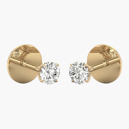 Gold earrings with clear gemstones on a white background
