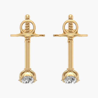 Gold earrings with clear gemstones on a white background