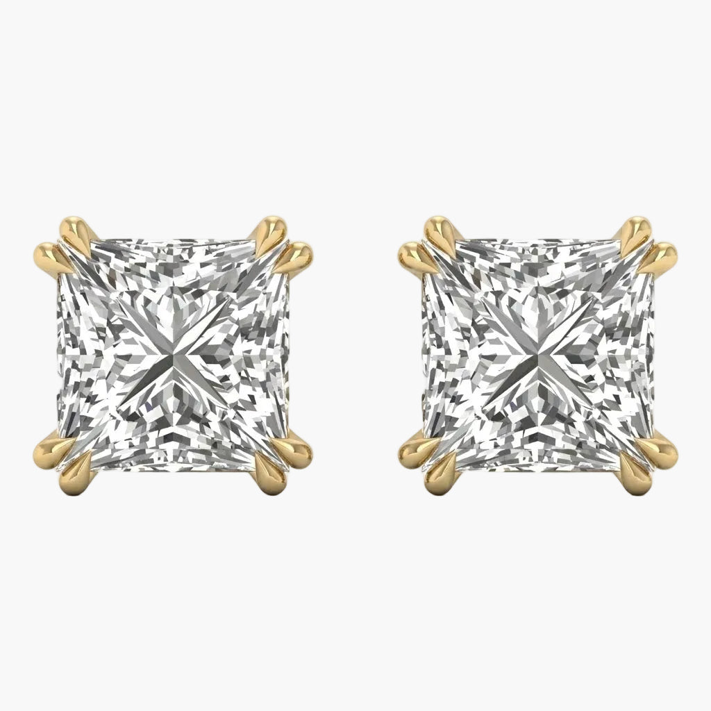 Pair of gold and diamond stud earrings on a white background