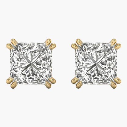 Pair of gold and diamond stud earrings on a white background