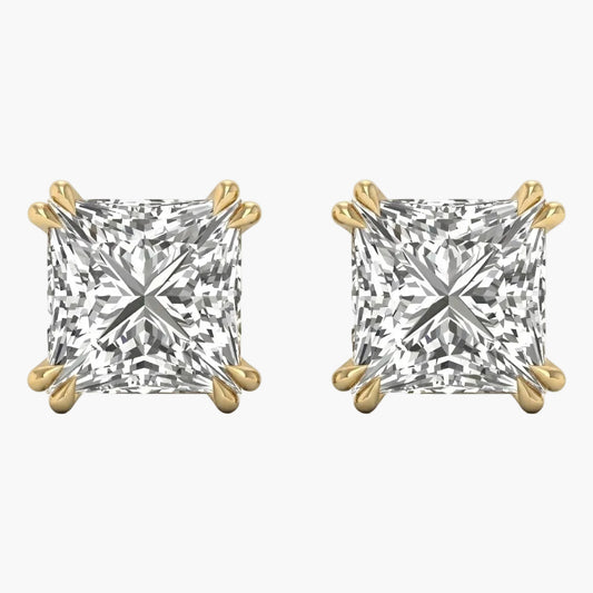 Pair of gold and diamond stud earrings on a white background