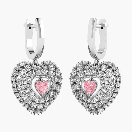 Heart-shaped earrings with pink center and diamond-like stones on a white background