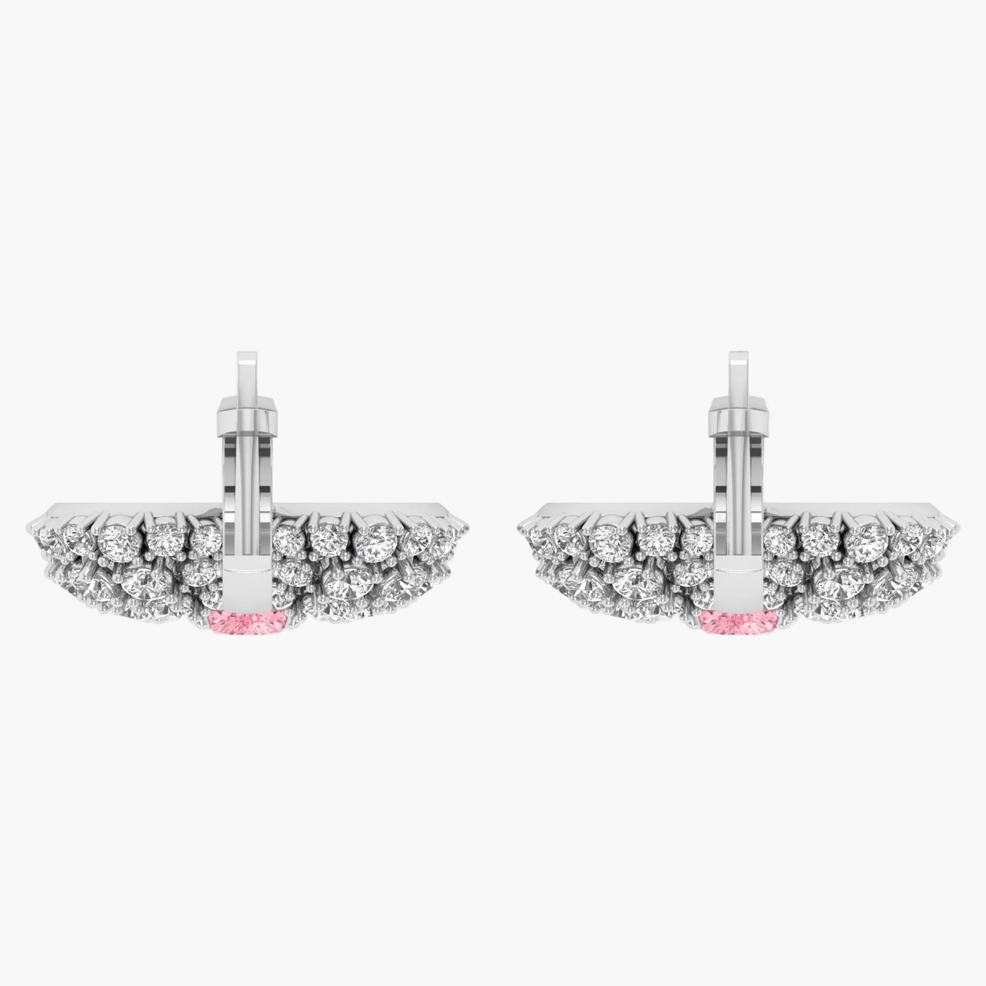 Pair of earrings with diamond accents on a white background