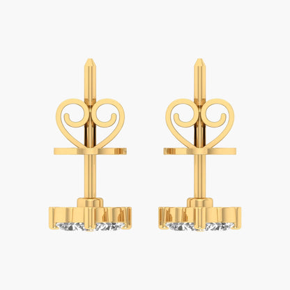 Gold earrings with decorative tops on a white background