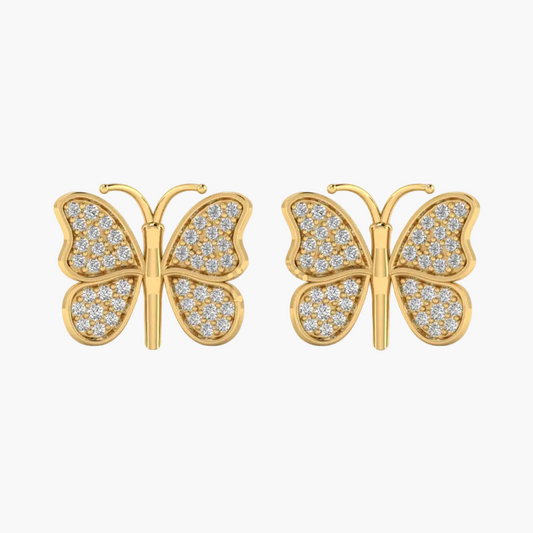 A pair of gold butterfly stud earrings paved with small clear stones, shown against a plain white background.