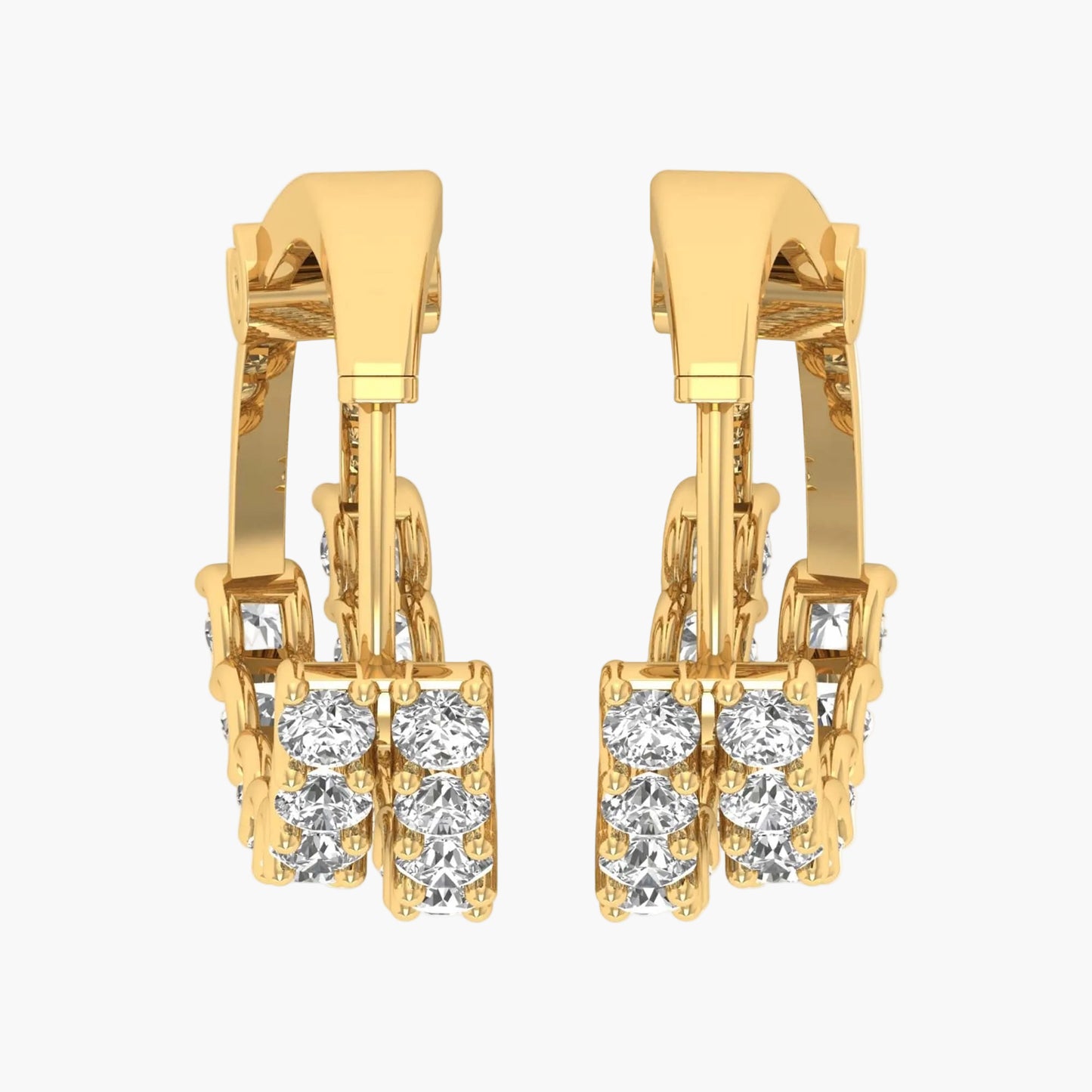 Gold hoop earrings with clear gemstones on a white background