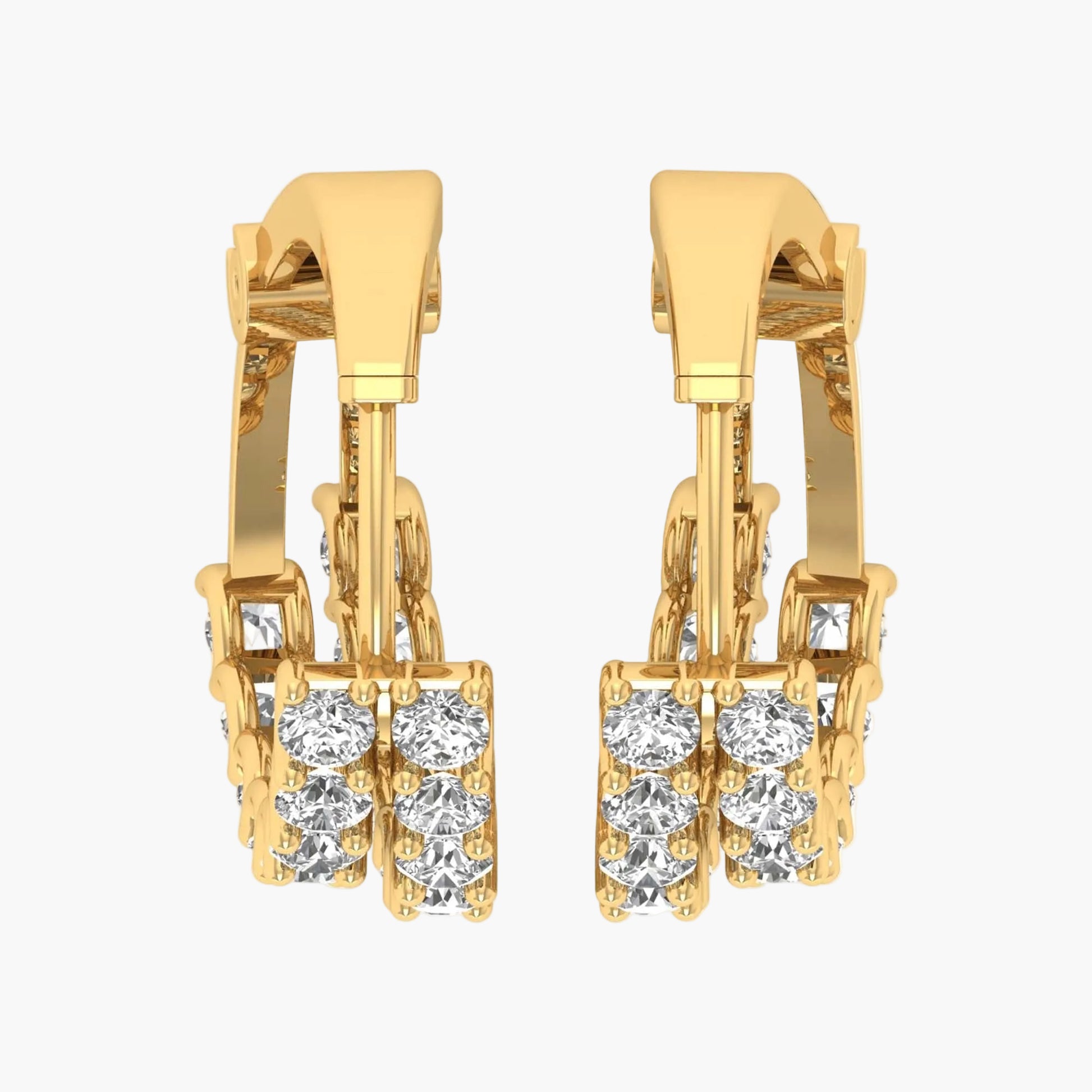 Gold hoop earrings with clear gemstones on a white background