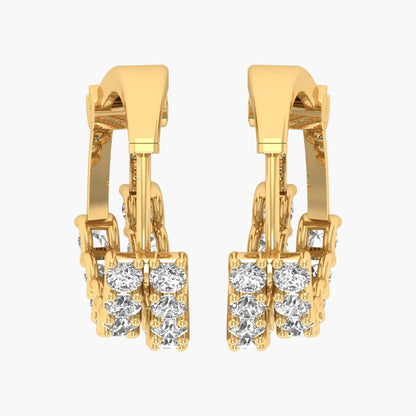 Gold hoop earrings with clear gemstones on a white background