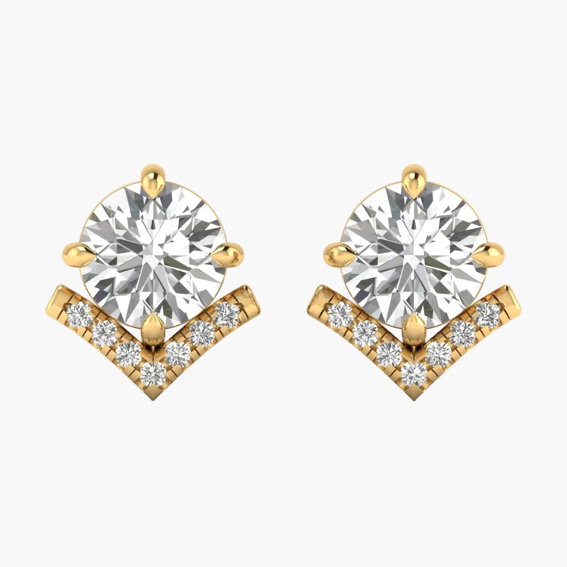 Gold earrings with clear gemstones on a white background