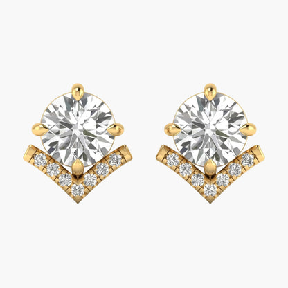 Gold earrings with clear gemstones on a white background