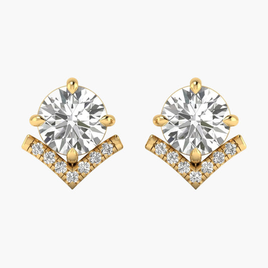 Gold earrings with clear gemstones on a white background
