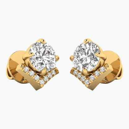 Gold earrings with large central gemstones and smaller diamonds on a white background