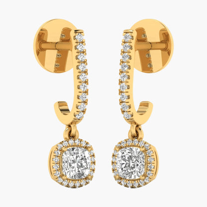 Gold hoop earrings with clear gemstones on a white background