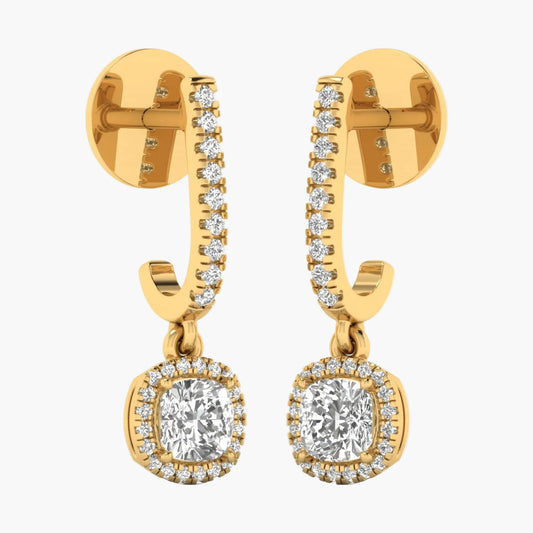Gold hoop earrings with clear gemstones on a white background
