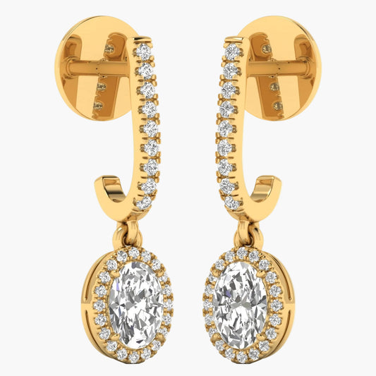 Gold earrings with clear gemstones on a white background