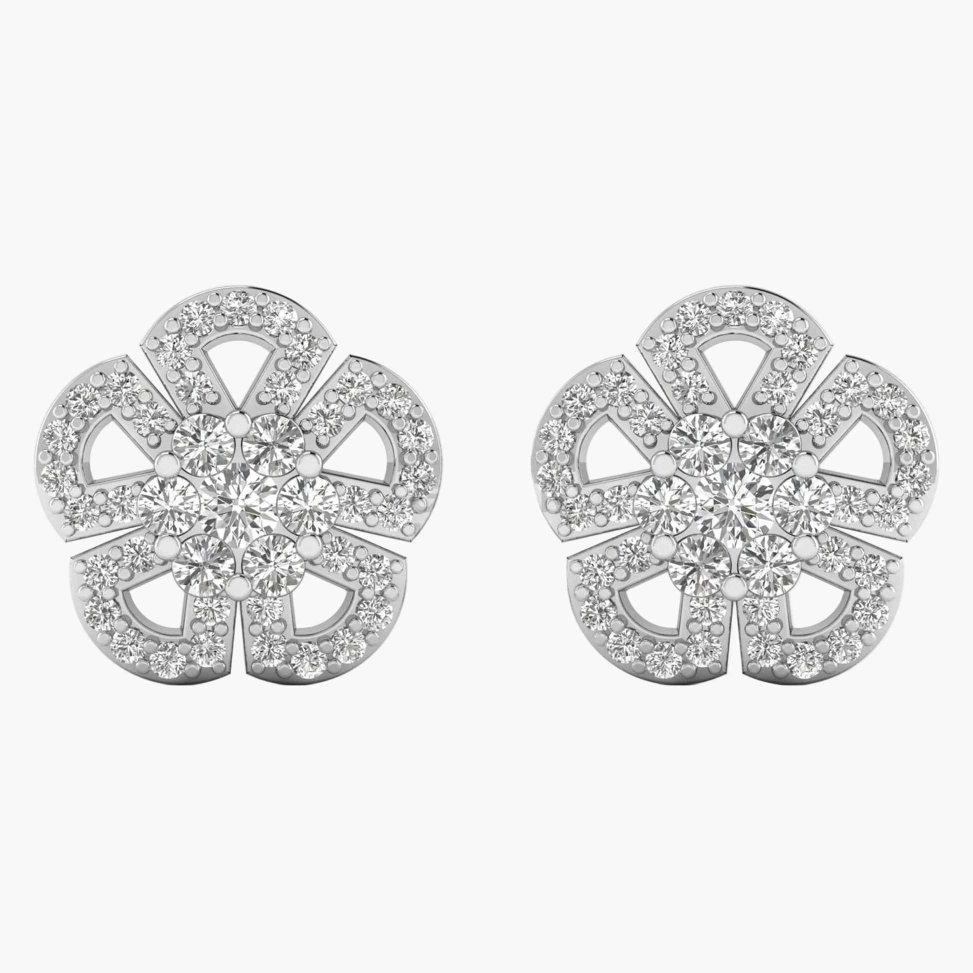 Pair of silver earrings with diamond-like stones on a white background