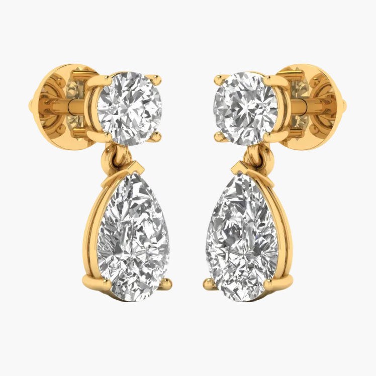 Gold and silver earrings displayed on a white background
