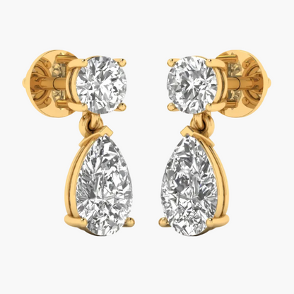 Gold and silver earrings displayed on a white background