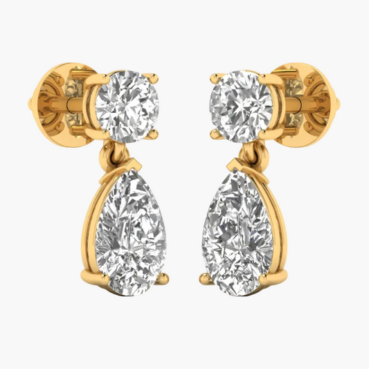 Gold and silver earrings displayed on a white background