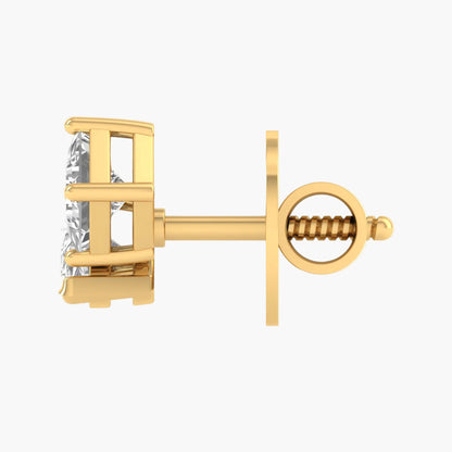 Gold earring with a clear gemstone on a white background