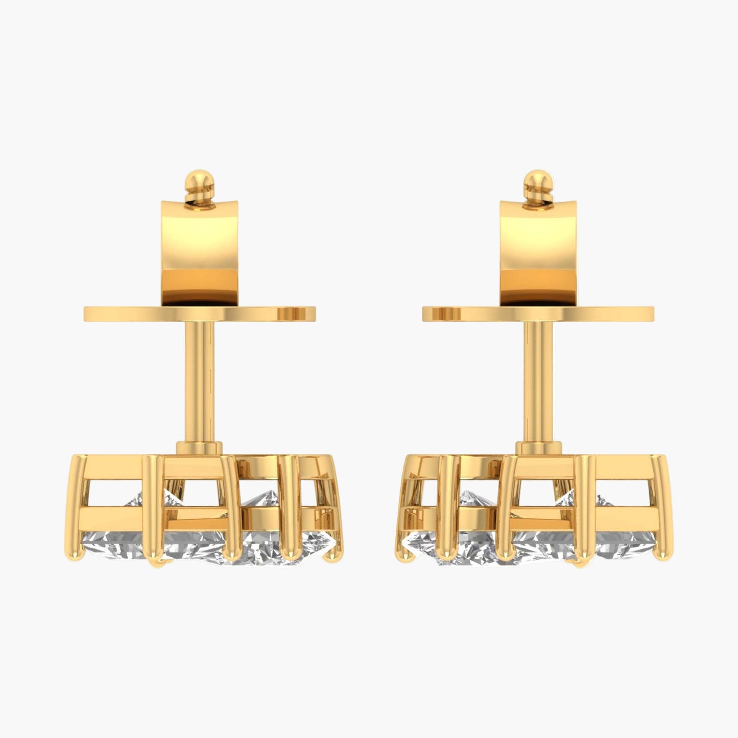 Pair of gold earrings with cylindrical tops on a white background