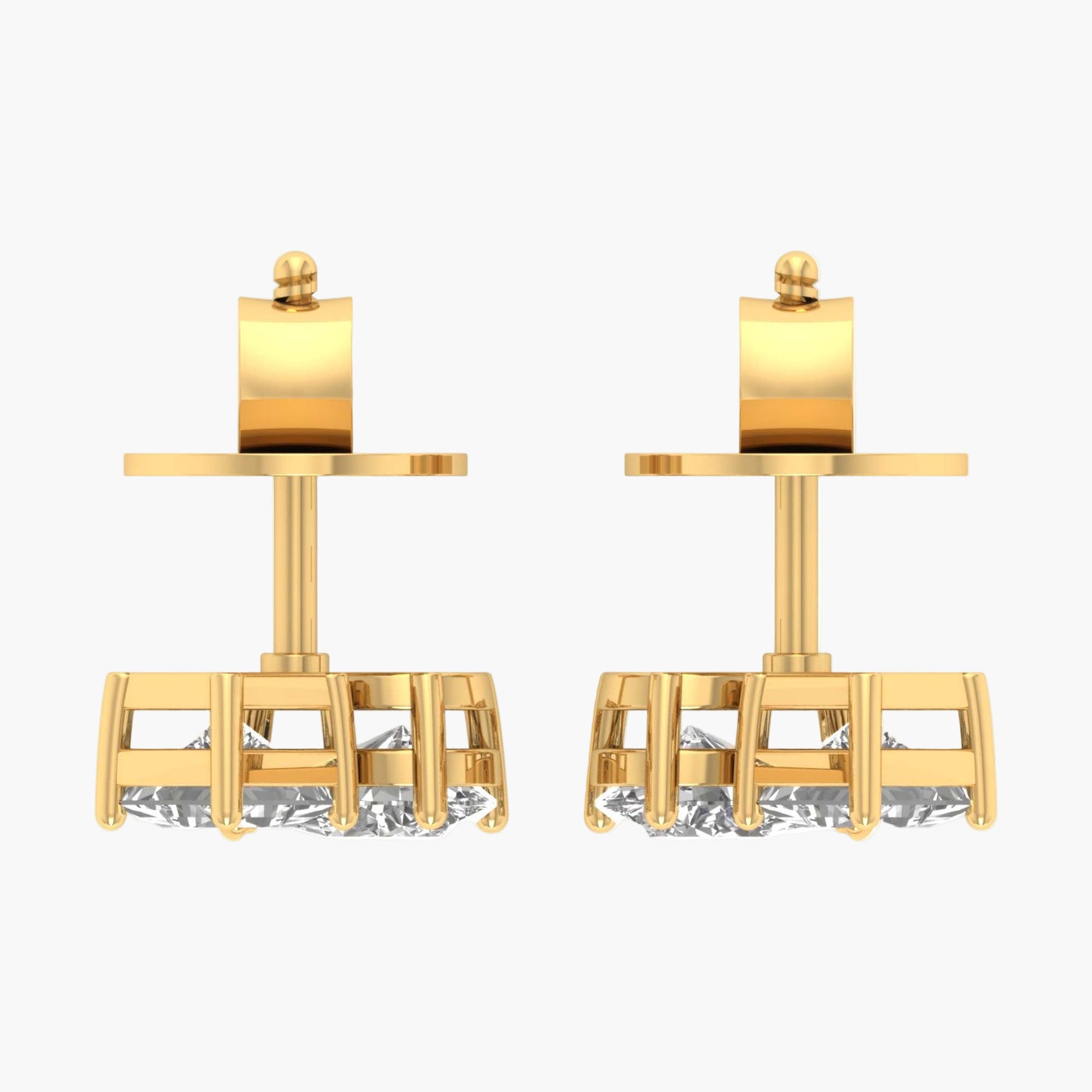Pair of gold earrings with cylindrical tops on a white background