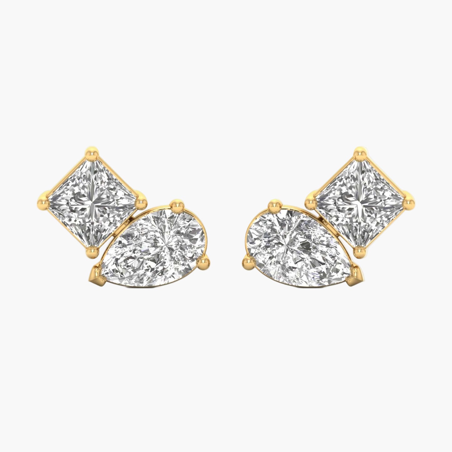 Gold earrings with clear gemstones on a white background