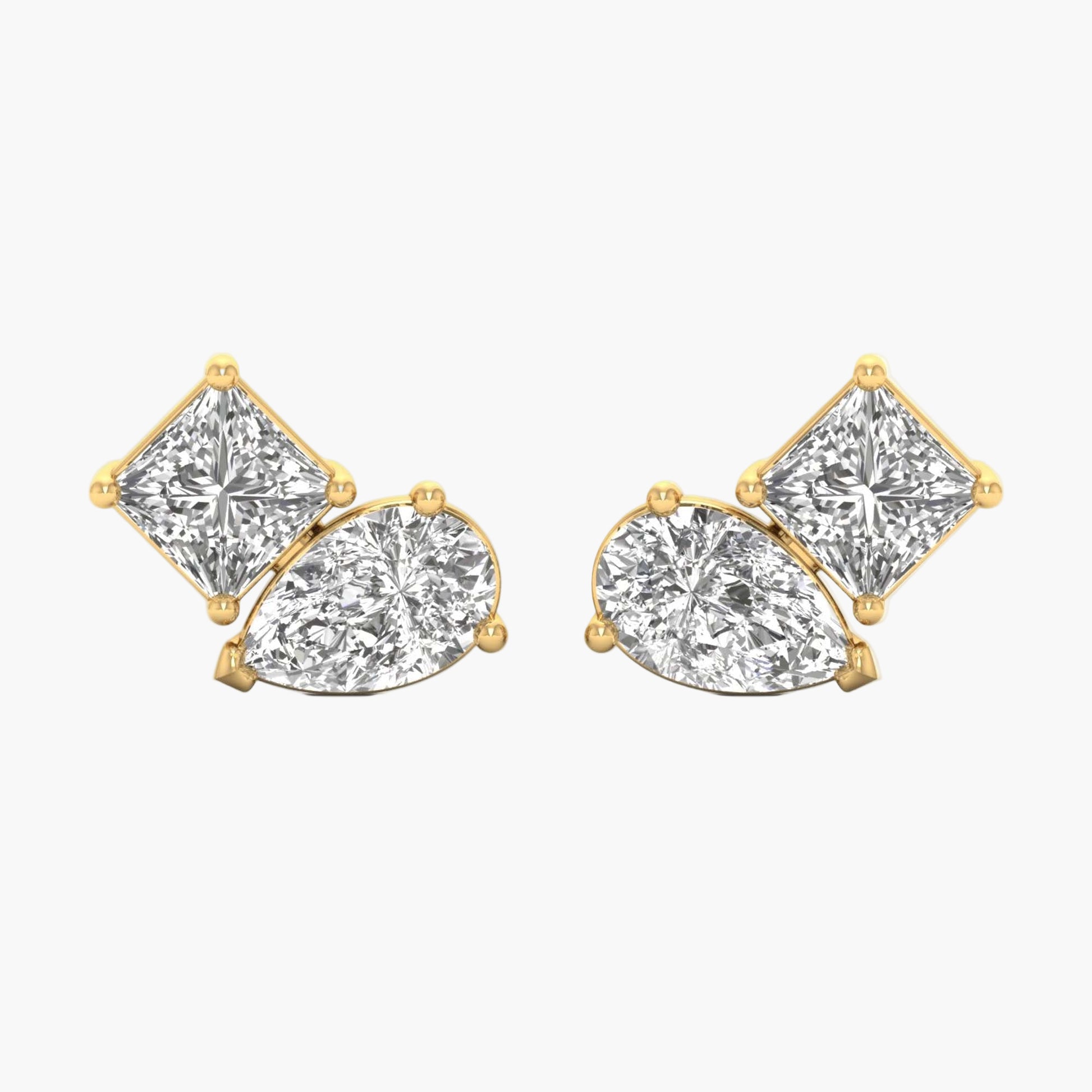 Gold earrings with clear gemstones on a white background