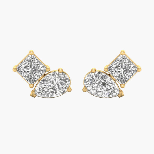 Gold earrings with clear gemstones on a white background
