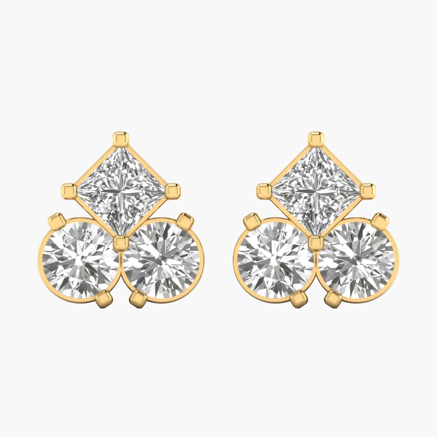 Gold and diamond earrings on a white background