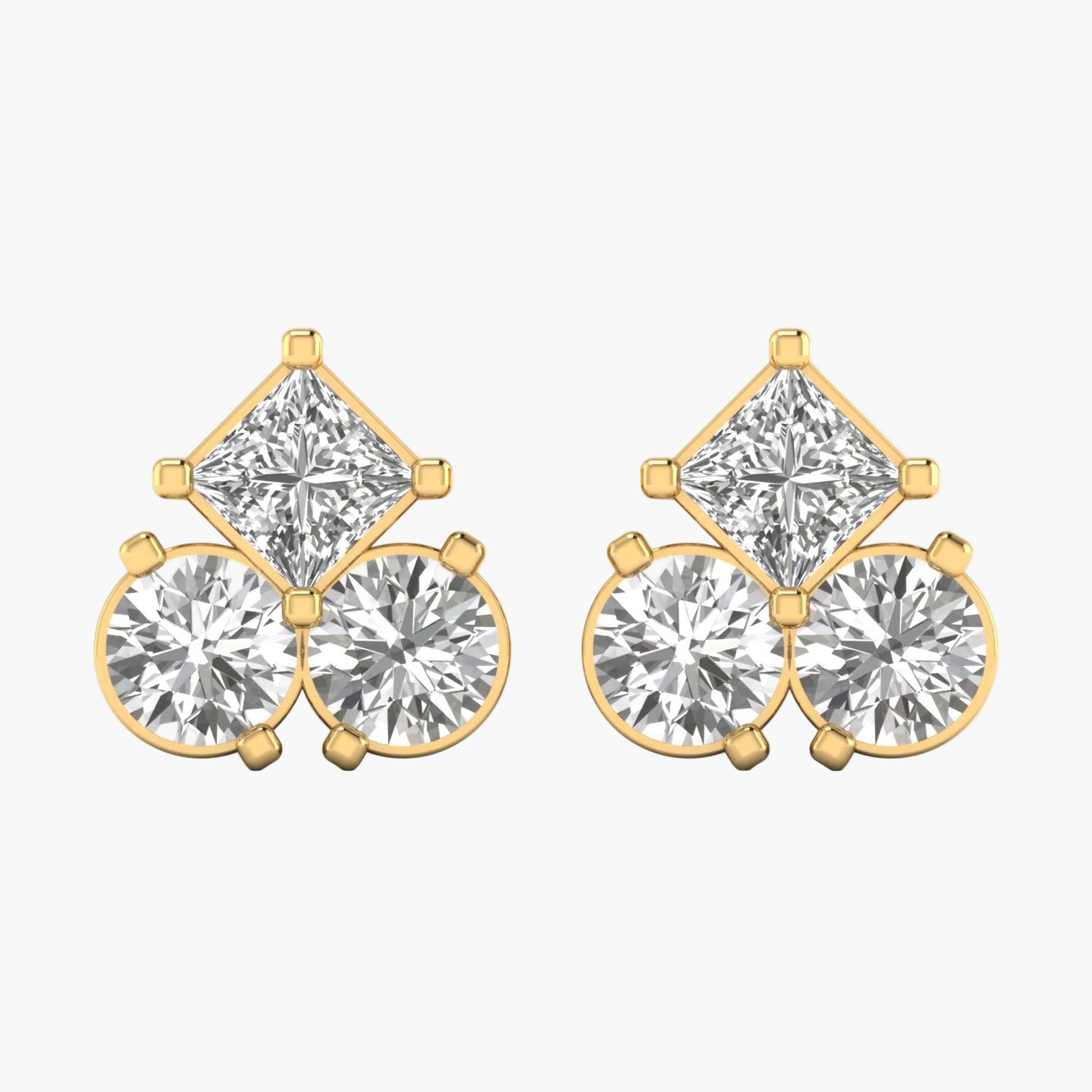 Gold and diamond earrings on a white background