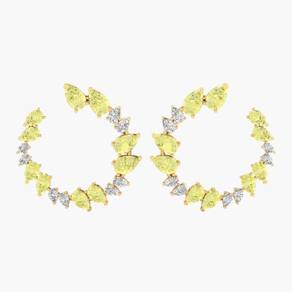 Pair of yellow gemstone hoop earrings on a white background