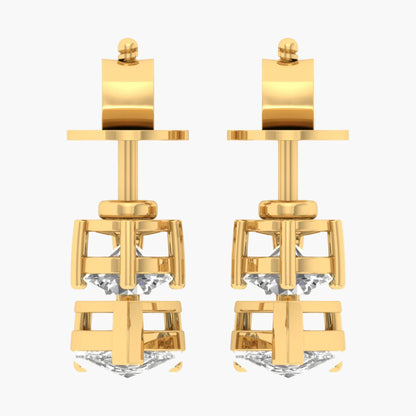 Gold earrings with diamond-like stones on a white background