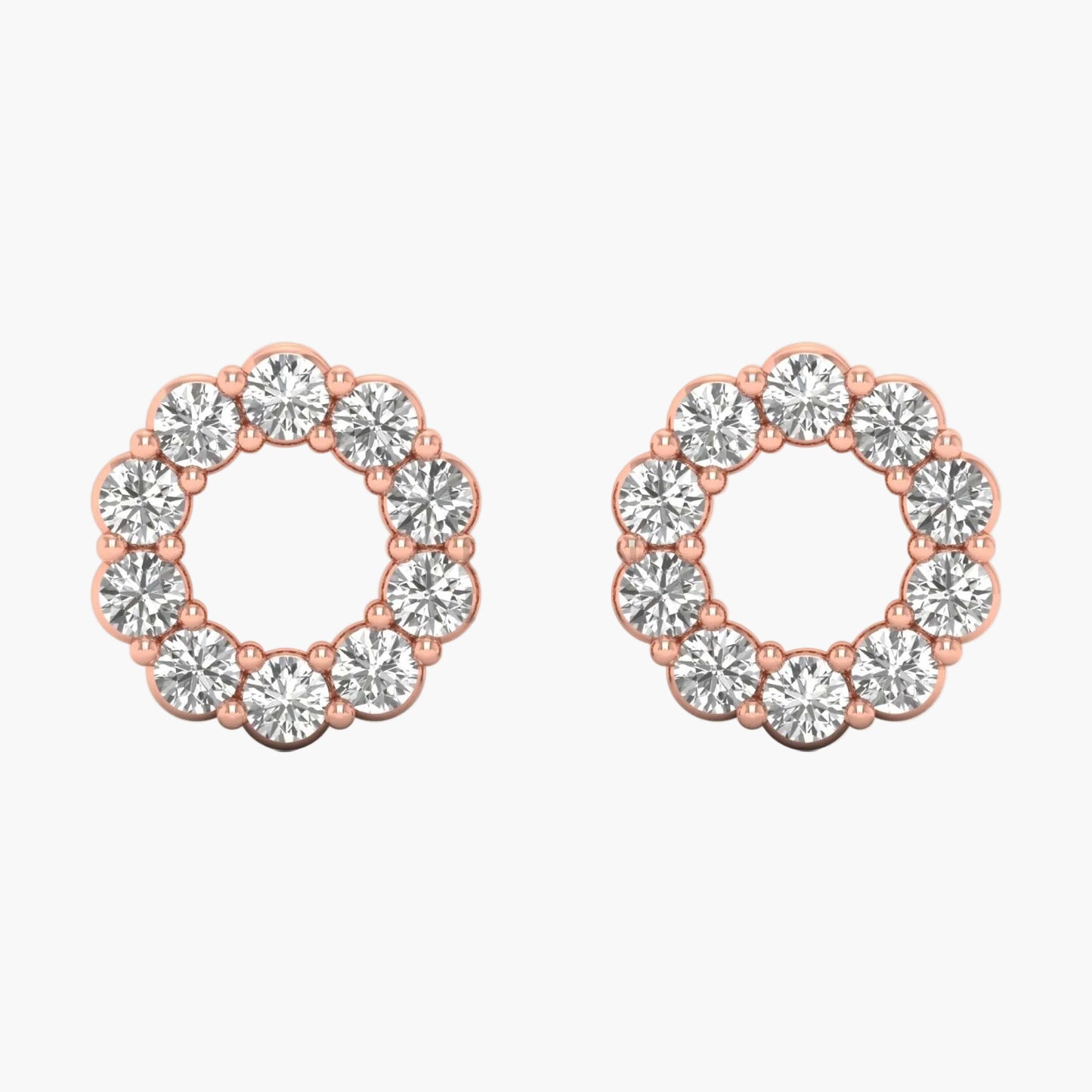 Pair of rose gold hoop earrings with clear gemstones on a white background