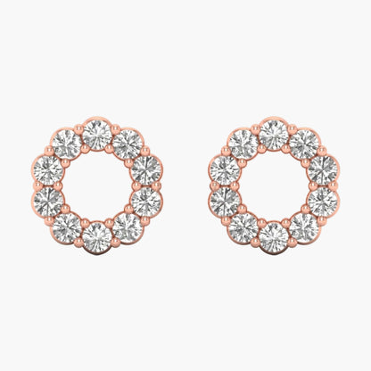Pair of rose gold hoop earrings with clear gemstones on a white background