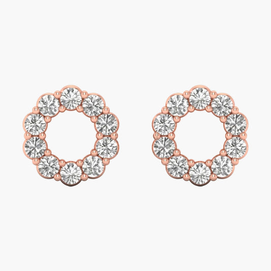 Pair of rose gold hoop earrings with clear gemstones on a white background