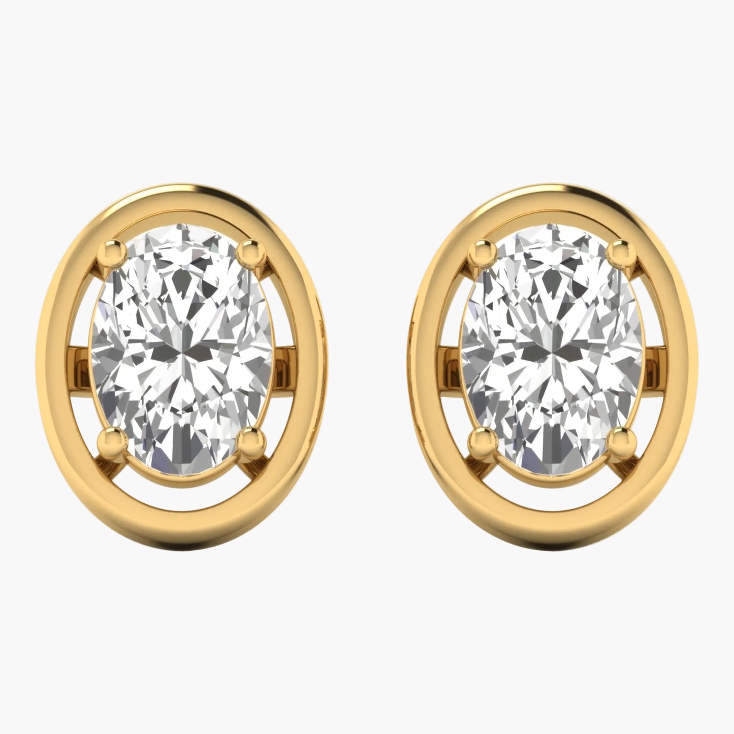 Gold earrings with clear gemstones on a white background